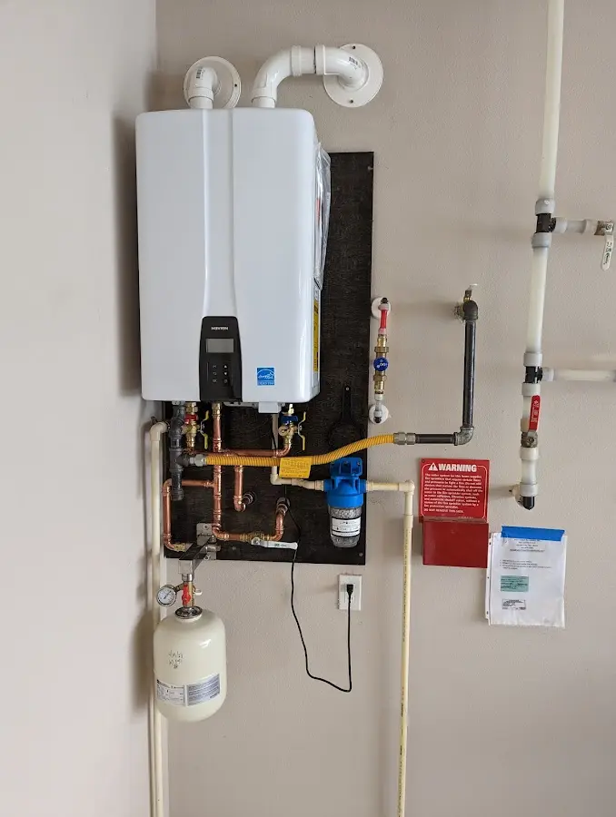 Professional plumber installing copper piping in a Kingsport home